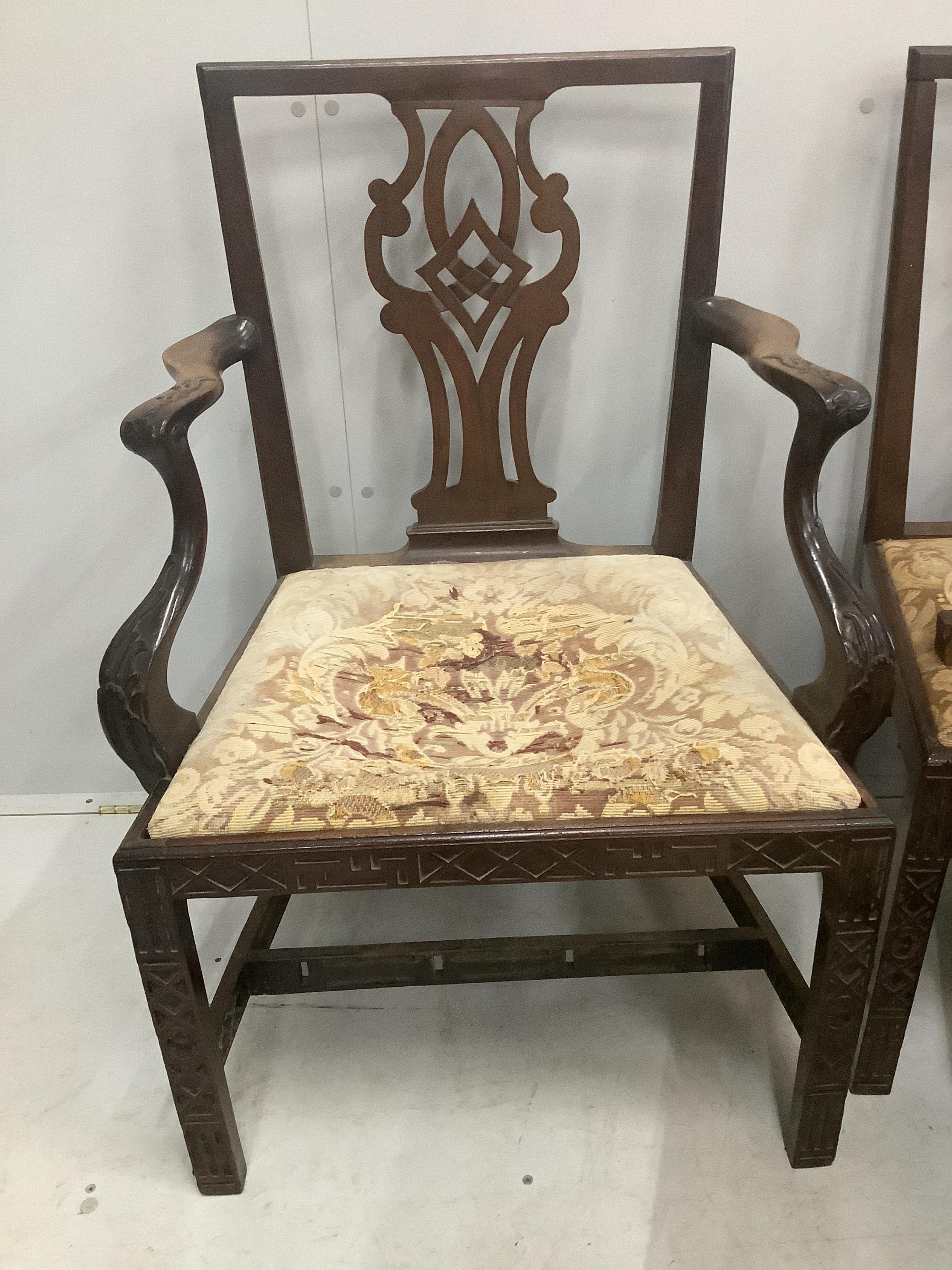 A set of six George III mahogany blind fret carved dining chairs, one with arms. Condition - poor to fair